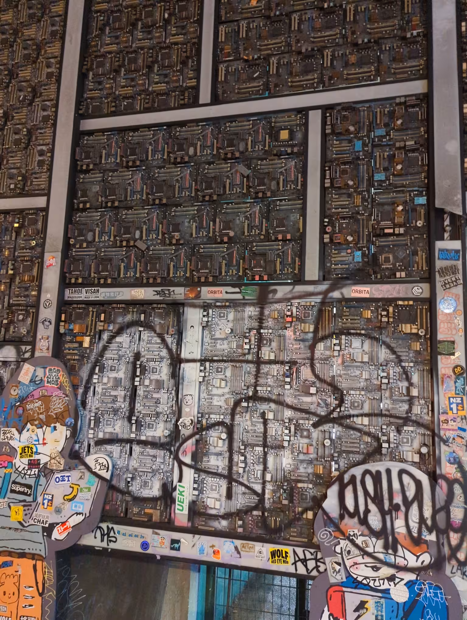 A wall under a highway overpass in Taipei made of computer motherboards