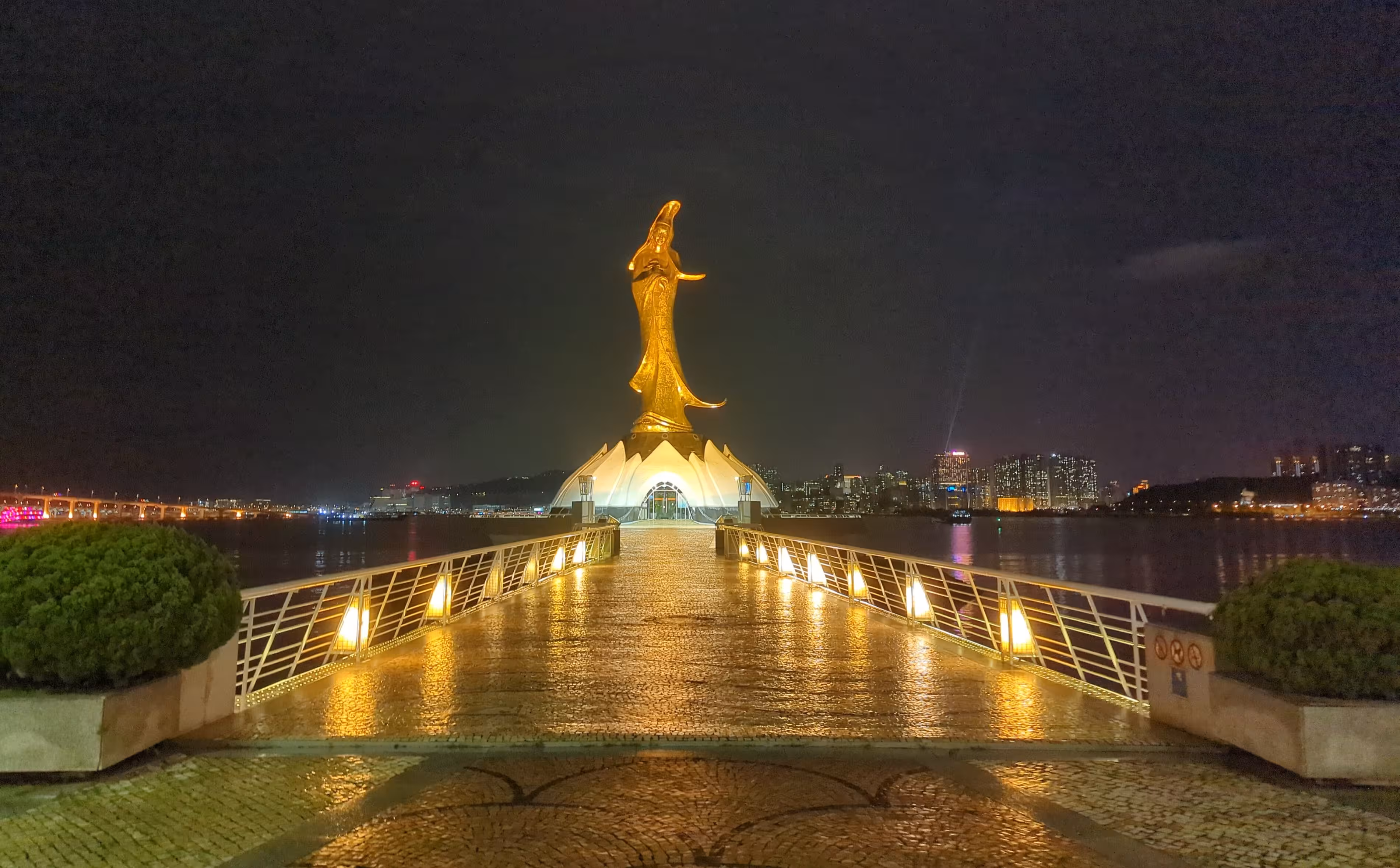A Guanyin statue at night