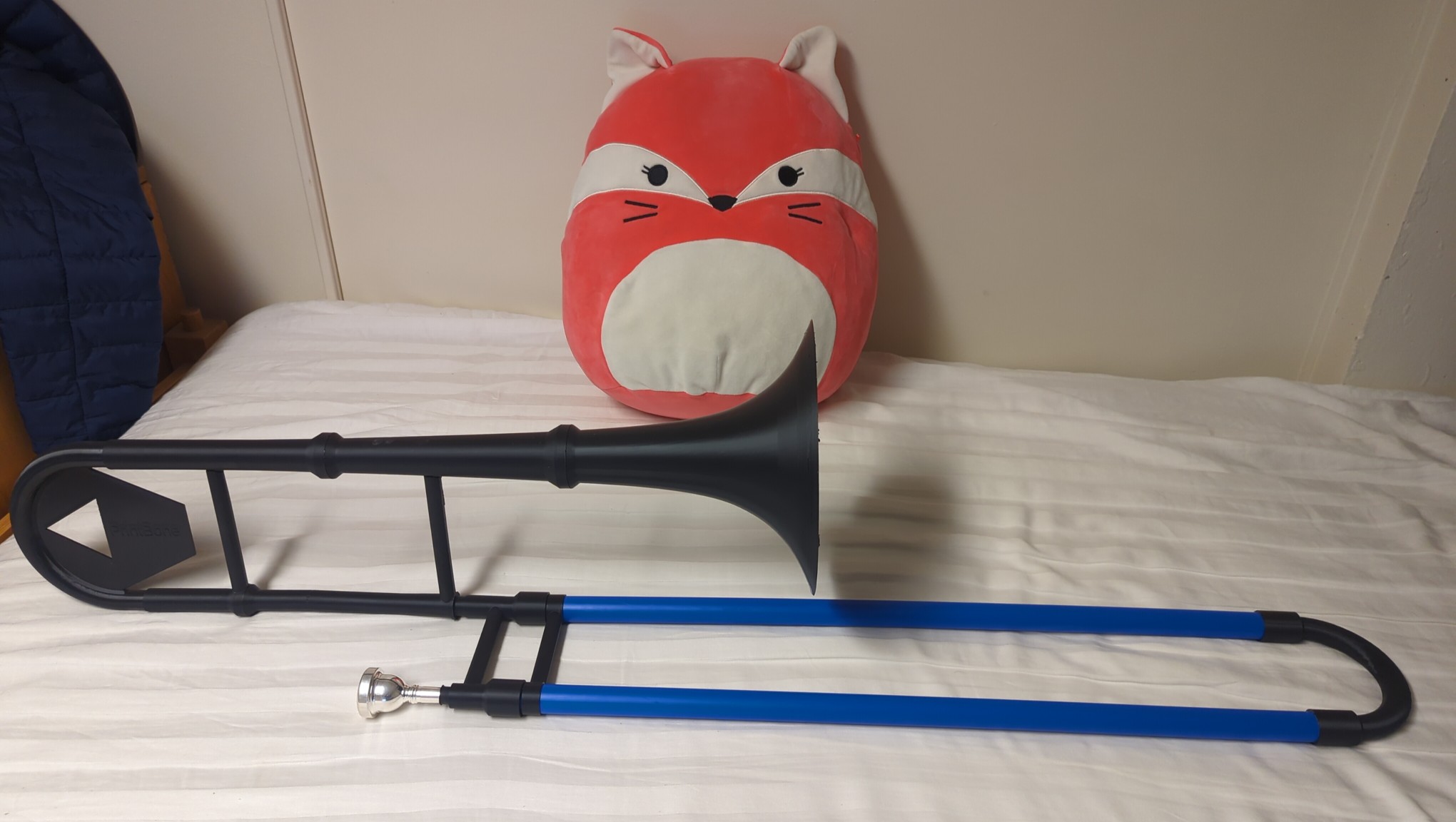 The plastic trombone and my fox plushie in the background